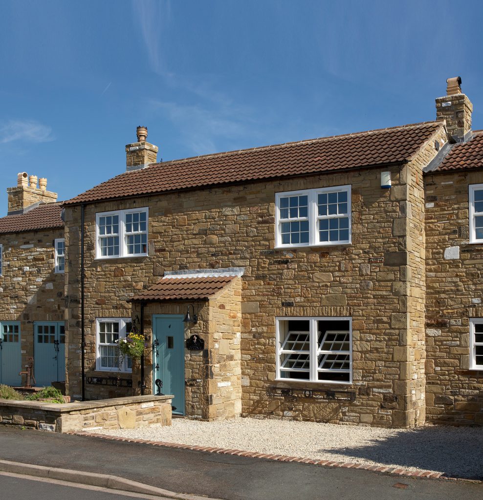 cottage with tilt and turn sash windows