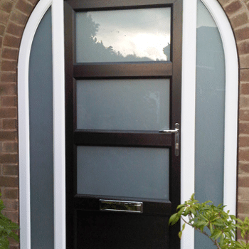 arched black composite door with 3 glass panels
