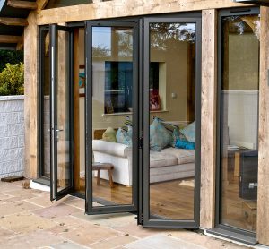 barn house with timber frame and bi fold doors