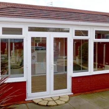 Contemporary double glazed conservatory with tiled roof
