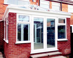 red brick conservatory with double glazed upvc patio doors