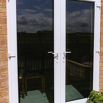 French Doors with potted plant outside