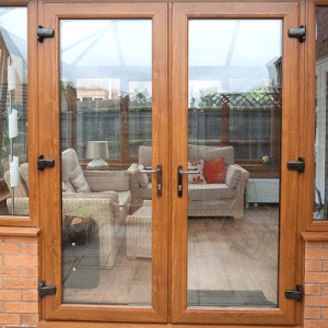 oak upvc french doors on a conservatory