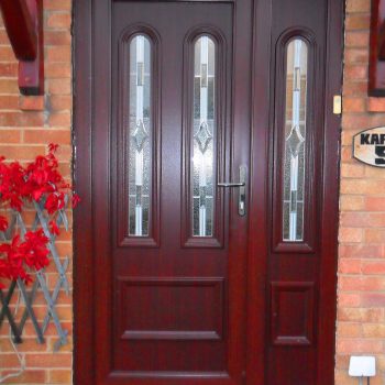 dark wood upvc panel front door with side panel