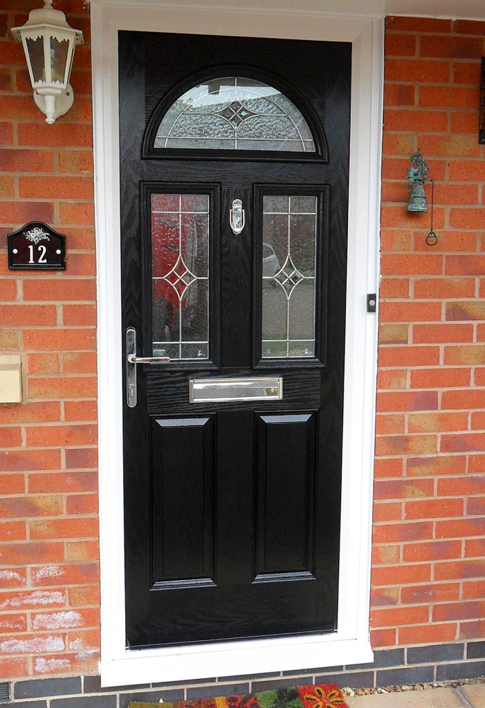 Composite black panel door with white upvc frame