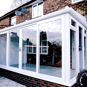 conservatory with tiled roof and white upvc