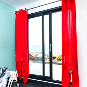 black Aluminium patio doors with red curtains