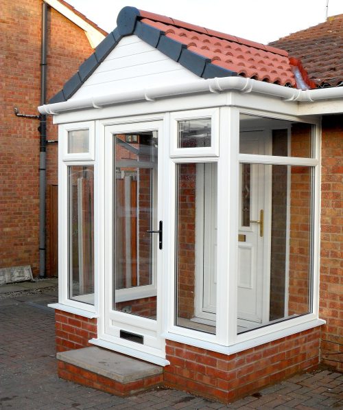 modern white upvc porch with red tiled roof