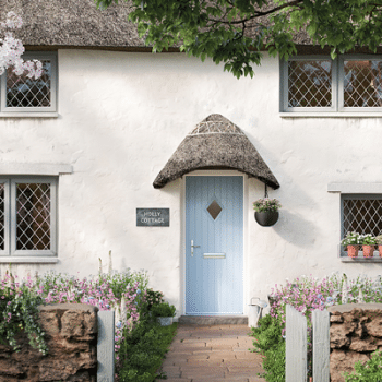 light blue solidcore door on a cottage