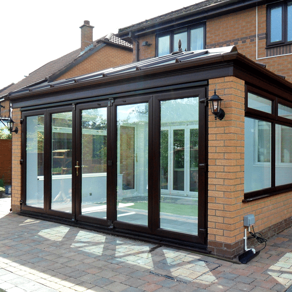 Edwardian Conservatory with glass roof and bi folding doors